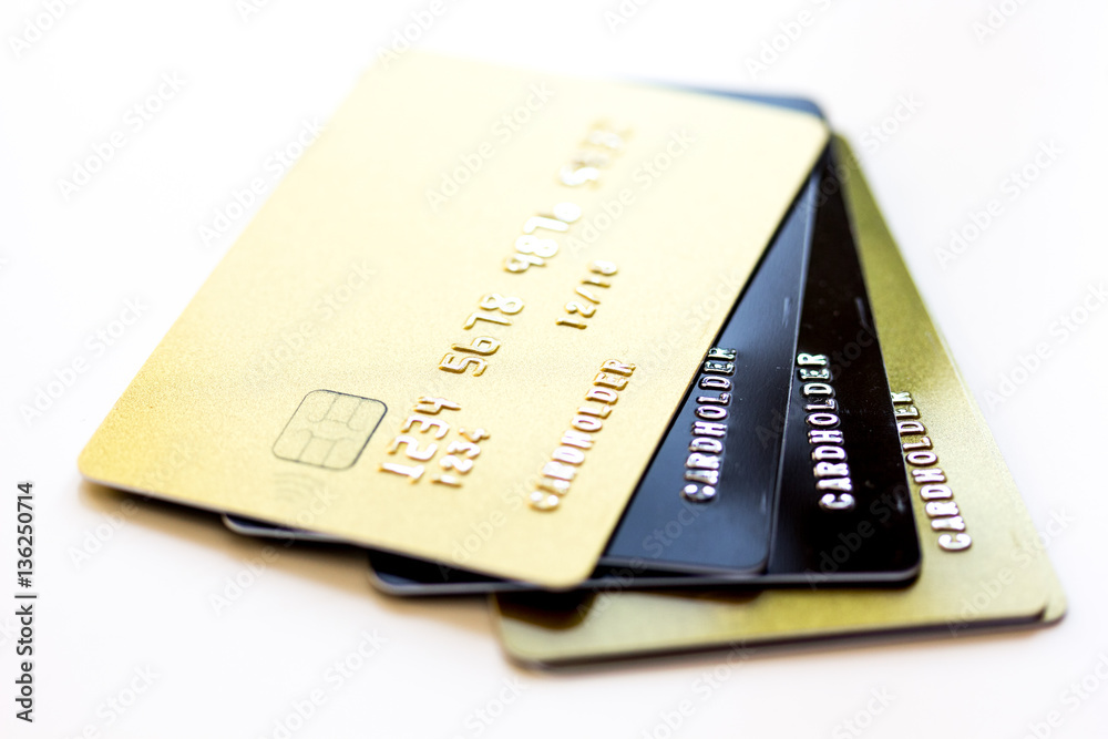 pile of credit cards on white background