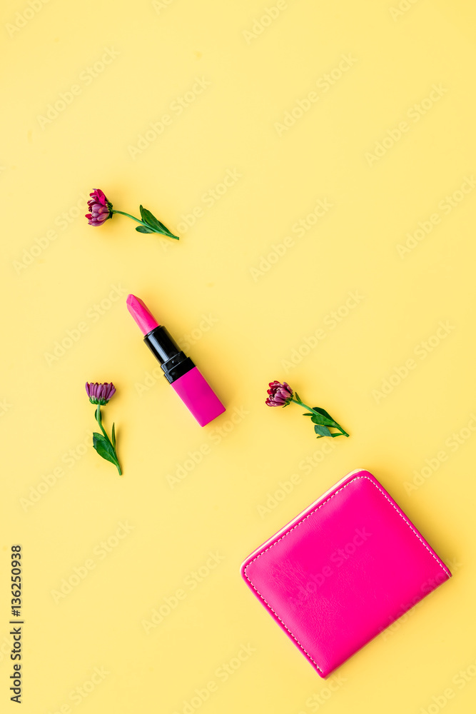 decorative cosmetics on yellow background top view