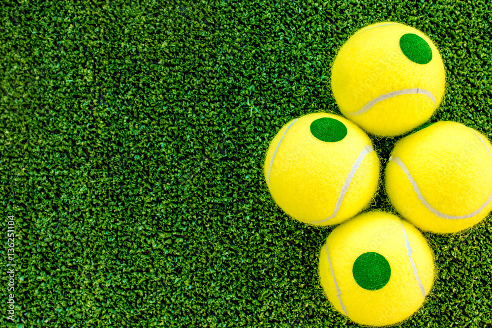 tennis ball on green background top view mock up