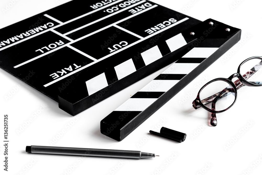 Screenwriter desktop with movie clapper board white background