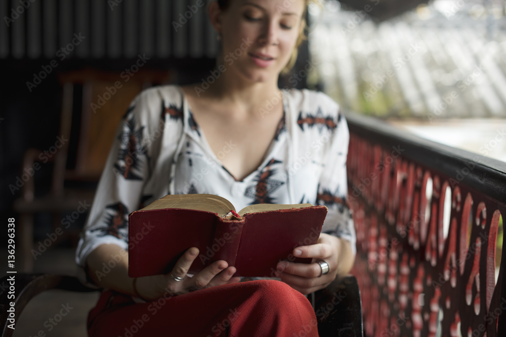 Young Woman Reading Book Concept