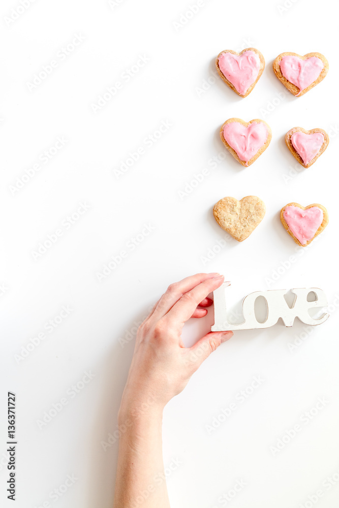 cookies for Valentine Day heartshaped white background top view pattern