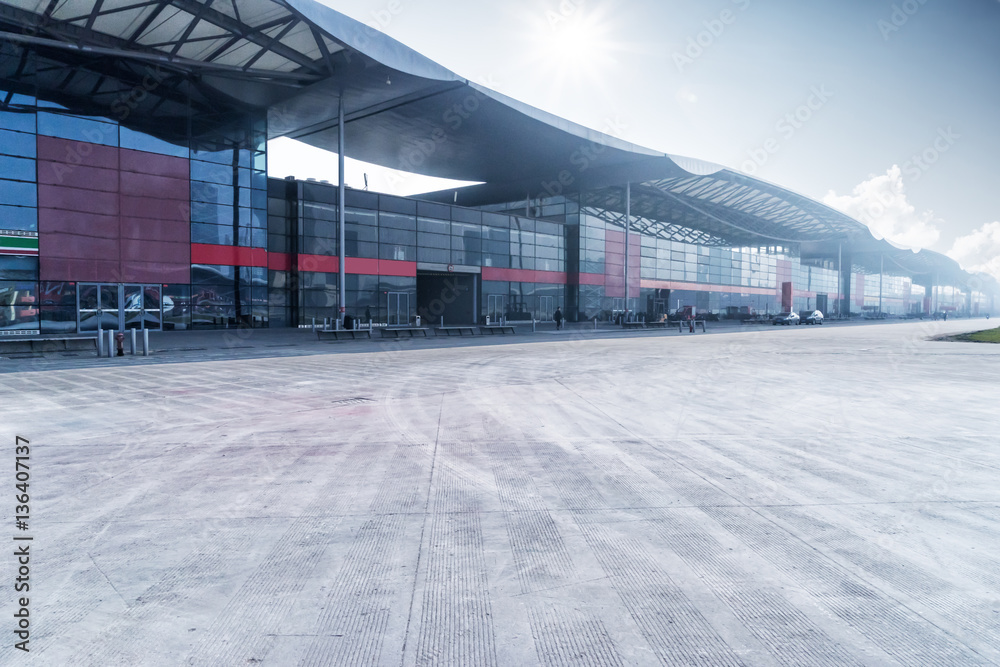 empty concrete floor and modern building with abstract top