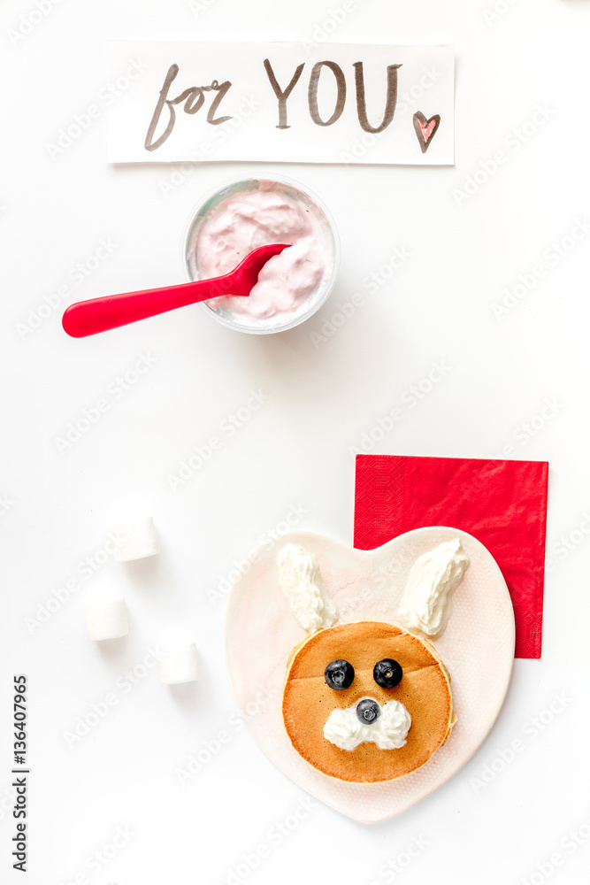 concept kid breakfast with pancake top view on white background