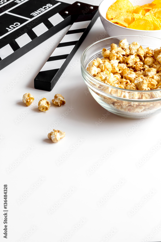 concept of watching movies with popcorn white background