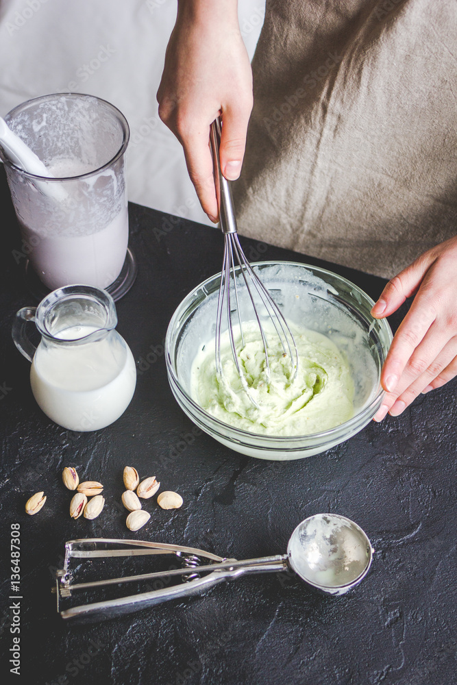 organic ice cream homemade process on dark background with hands