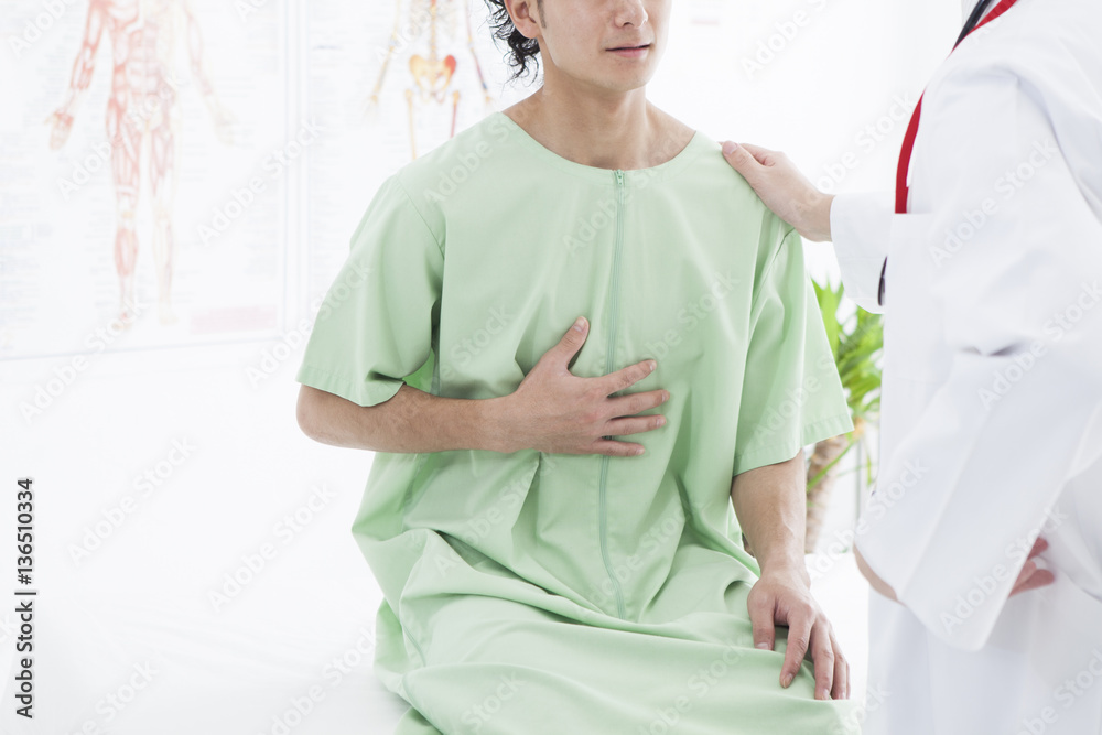 A man is visiting a hospital with stomach pain