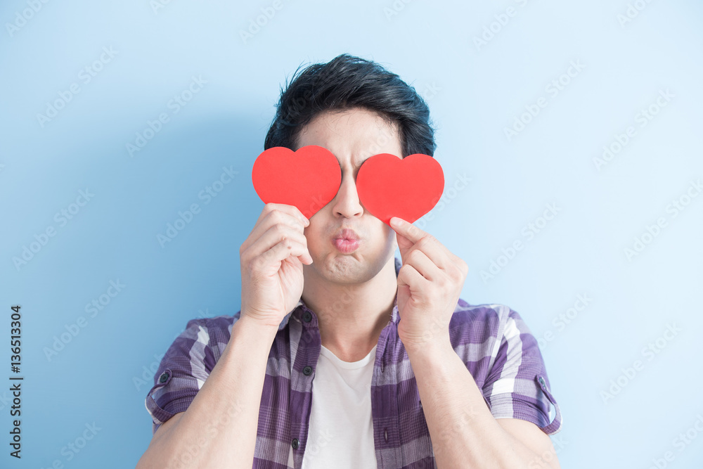 young man holding love hearts