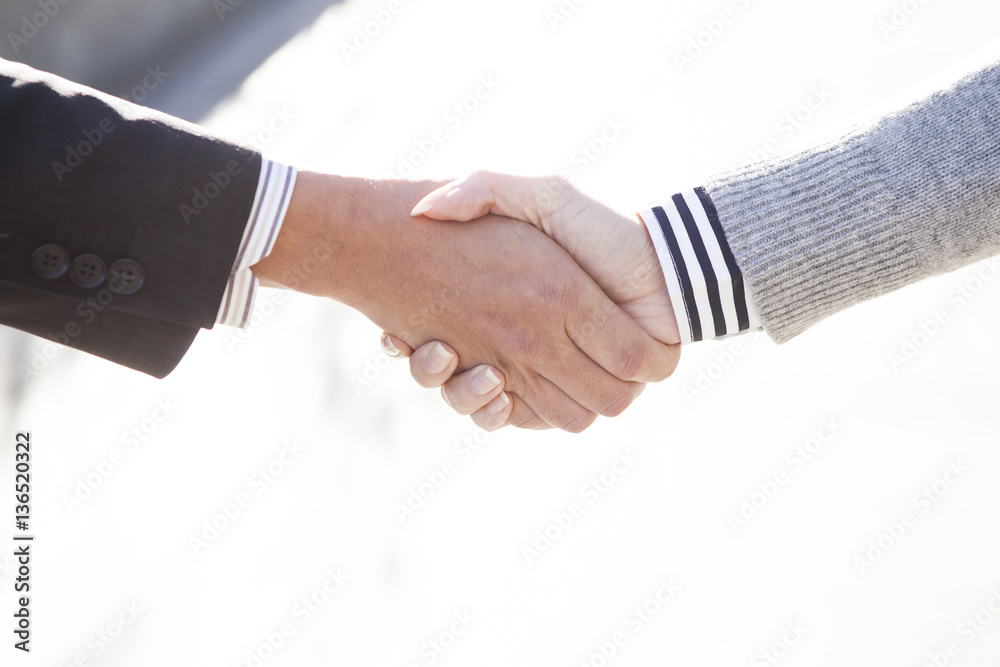 Firm handshake of businessman