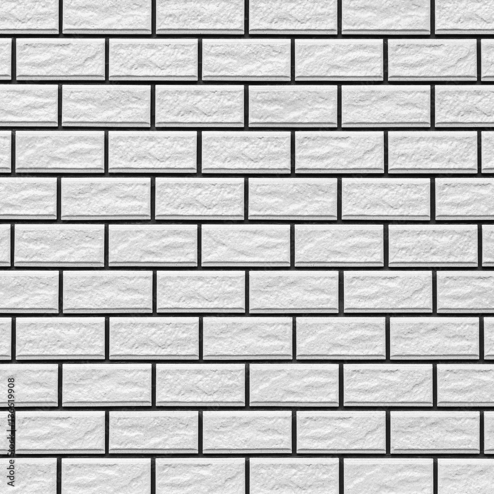 The modern white concrete tile wall background and texture..