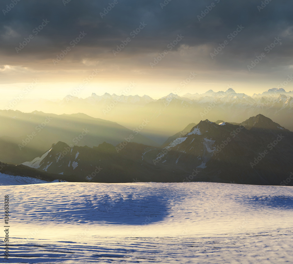 Mountain ridge during sunrise. Beautiful natural panoramic landscape in the summer time