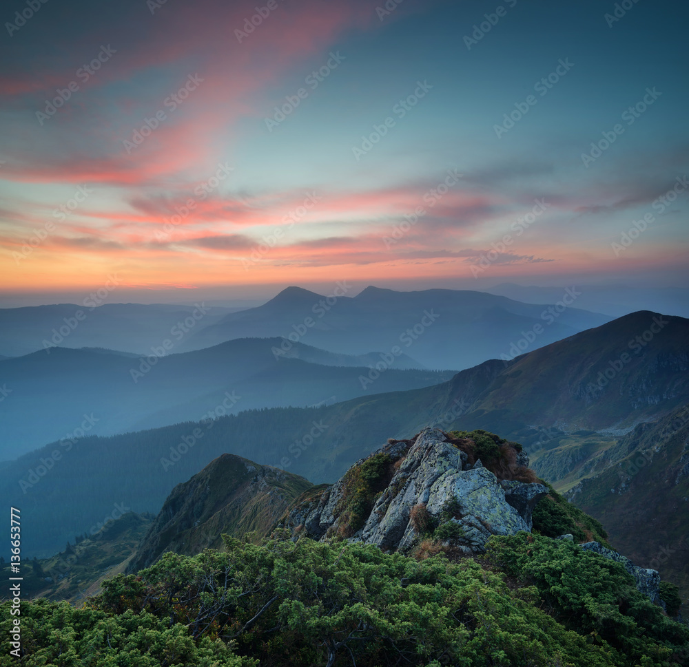 Mountains during sunset. Beautiful natural landscape in the summer time..