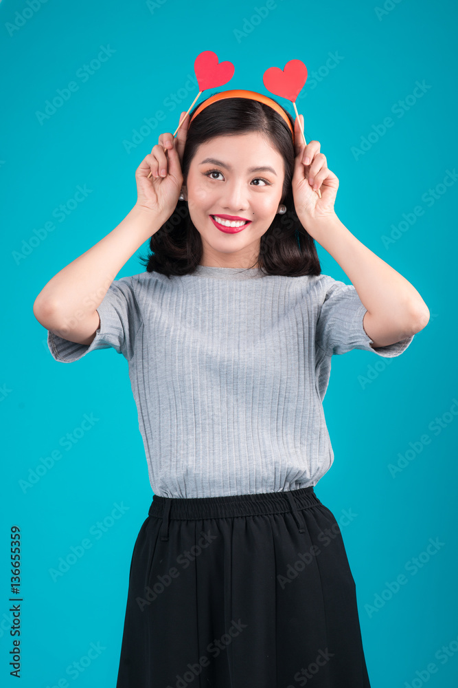 Woman on Valentines Day. Young asian beautiful girl holding red