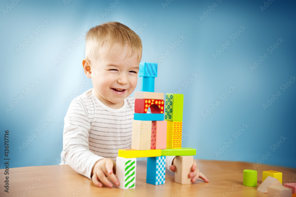 Portrait of a two years old child sitting at the table