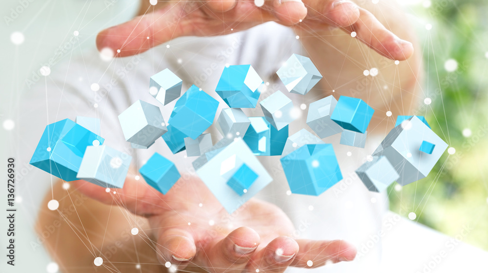 Businessman holding flying blue shiny cube 3D rendering