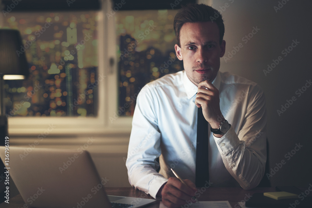 Portrait of serious positive businessman