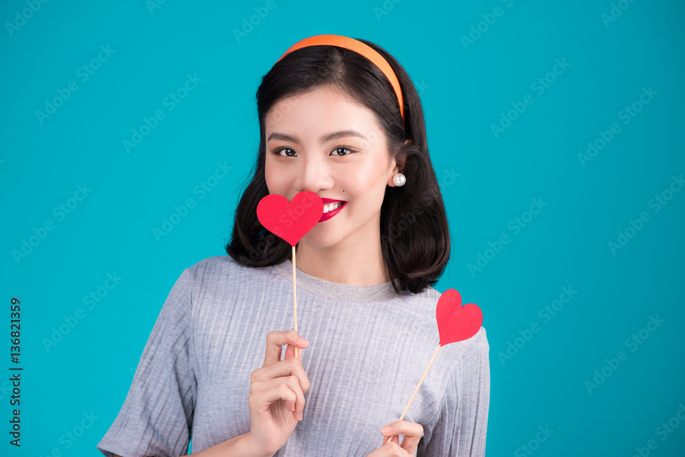 Woman on Valentines Day. Young asian beautiful girl holding red