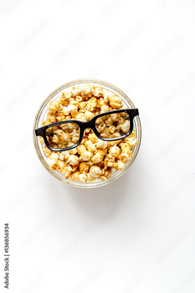 concept of watching movies with popcorn top view white background