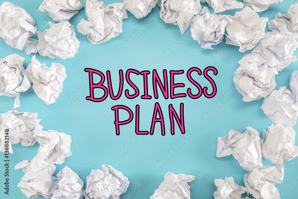 Business Plan text with crumpled paper balls