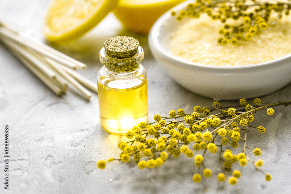 Natural bath salt and organic oil on gray background