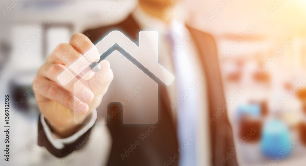 Businessman holding 3D rendering icon house in his hand