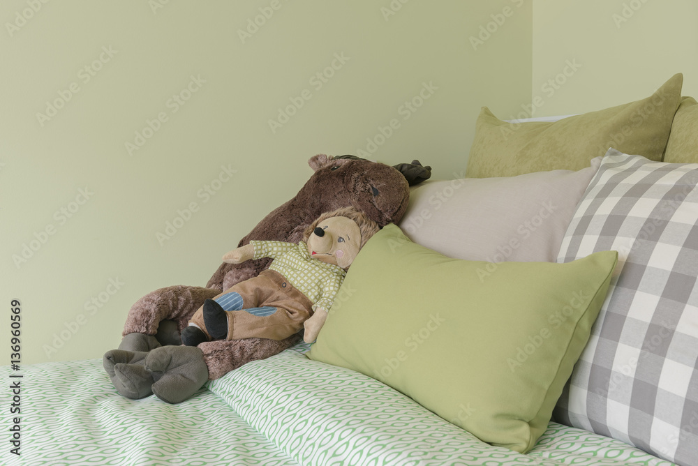 kids bedroom with green color tone and dolls