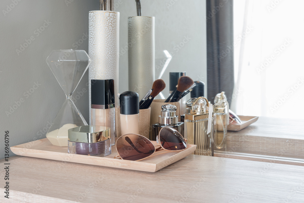 Beauty and make-up concept: table mirror, flowers, perfume, jewe