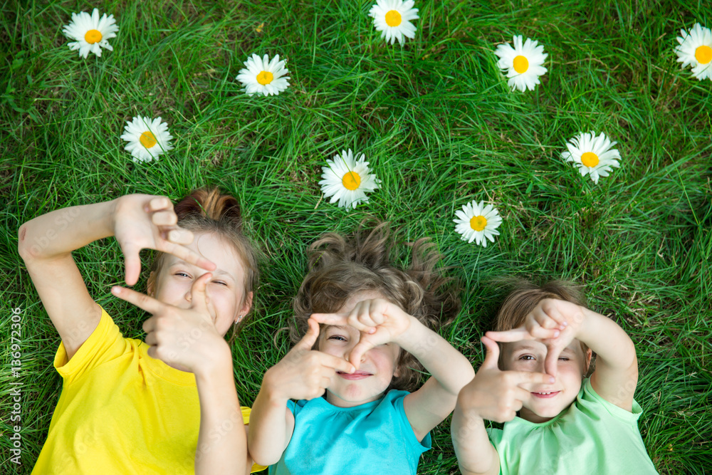 Group of happy children playing outdoors