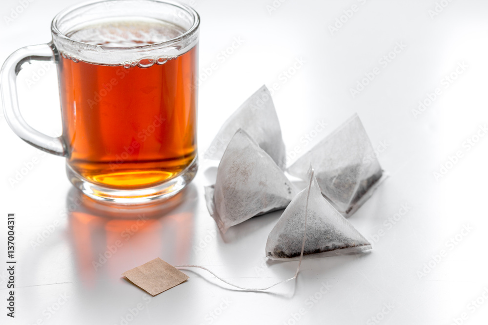 Cup of tea with teabags on white background mock up