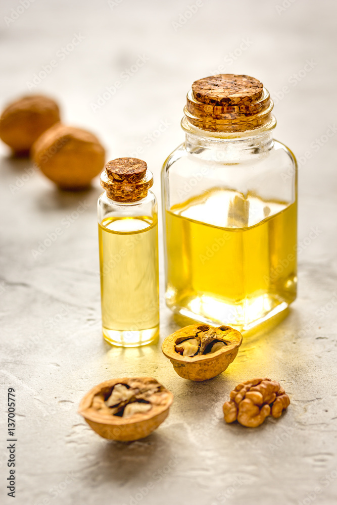 cosmetic and therapeutic walnut oil on gray background