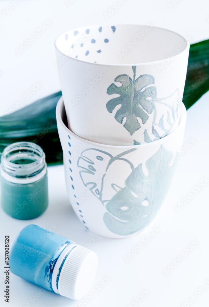 painted ceramic cup on white background