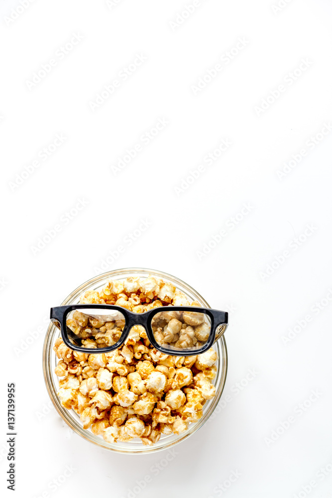 concept of watching movies with popcorn top view white background