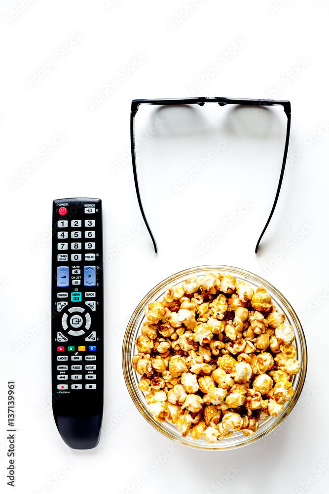 concept of watching movies with popcorn top view white background