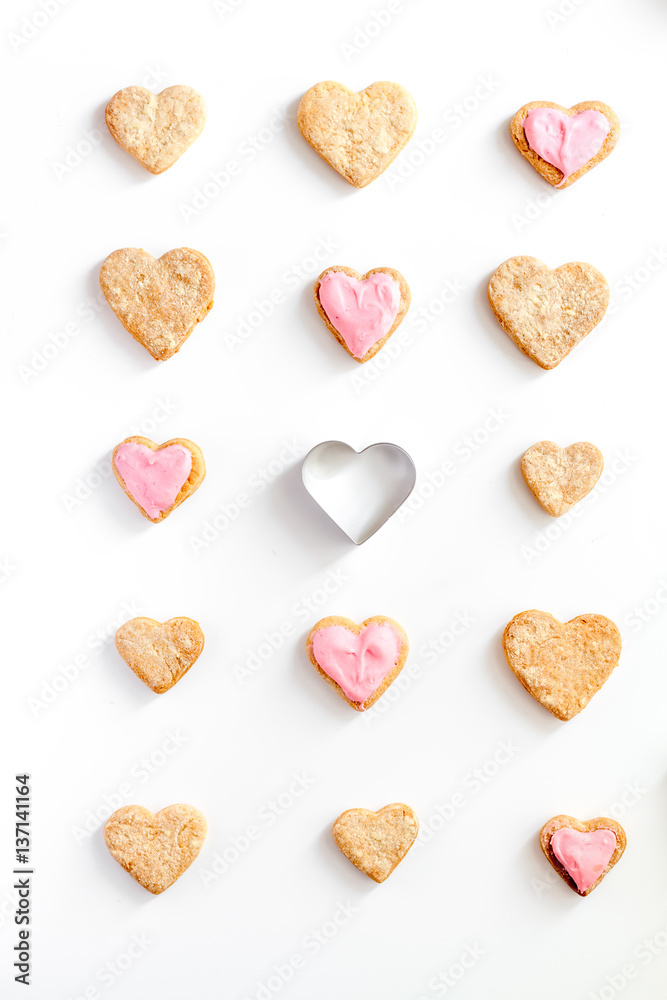 cookies for Valentine Day heartshaped white background top view pattern