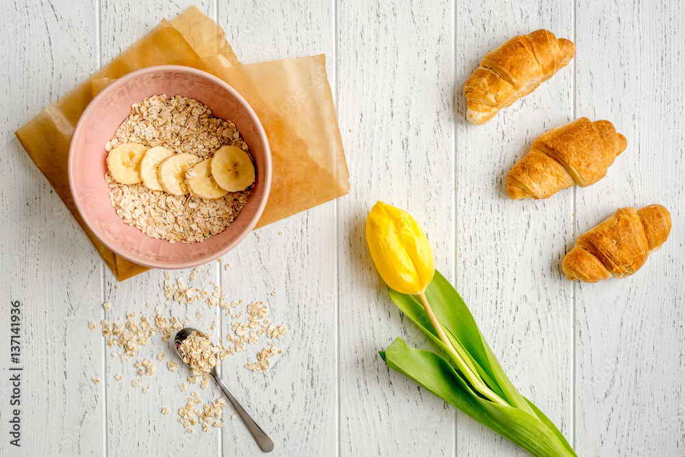 healthy breakfast with porridge on wooden background top view