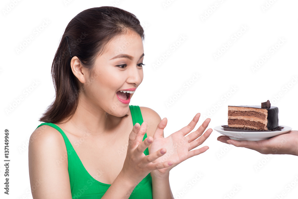 Beautiful smiling asian young woman with a chocolate cake isolated on white background.