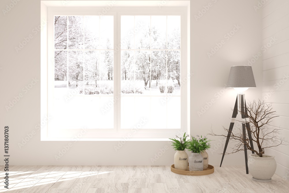 White room with lamp and winter landscape in window. Scandinavian interior design