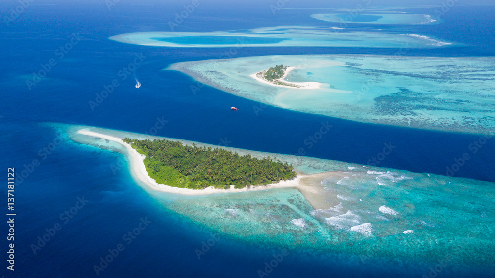 Small tropical island in Maldives atoll