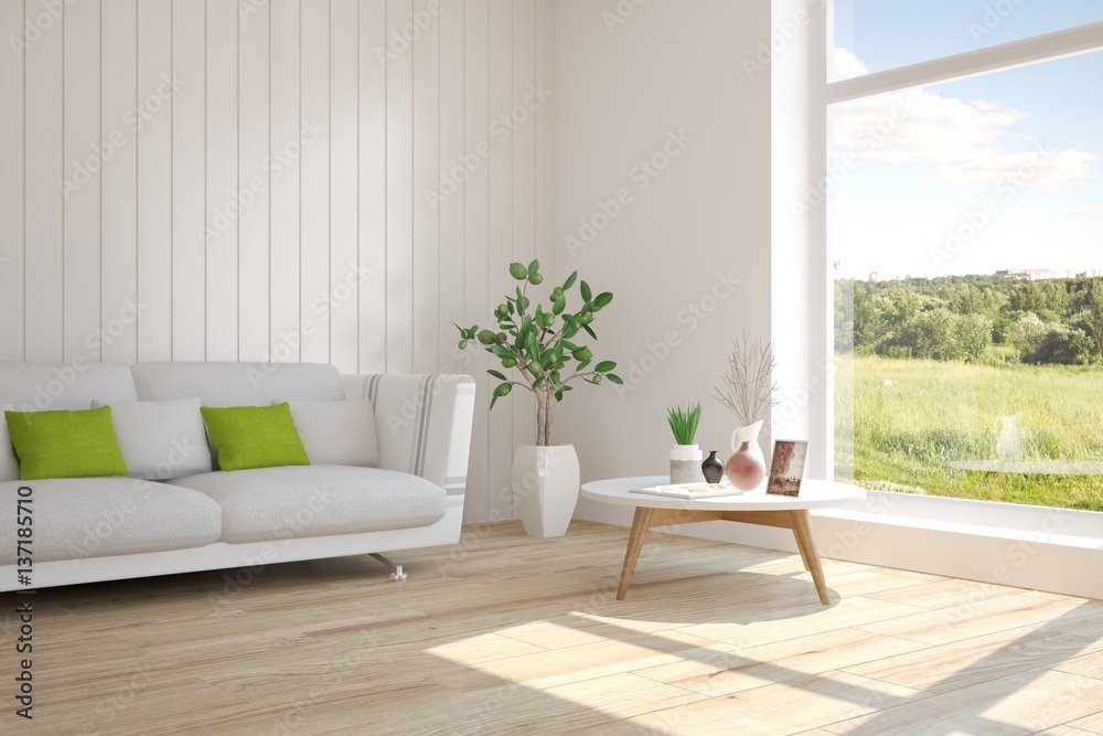 White room with sofa and green landscape in window. Scandinavian interior design