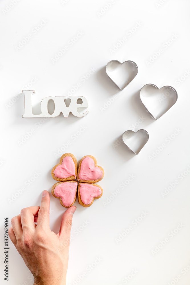 cookies for Valentine Day heartshaped white background top view pattern