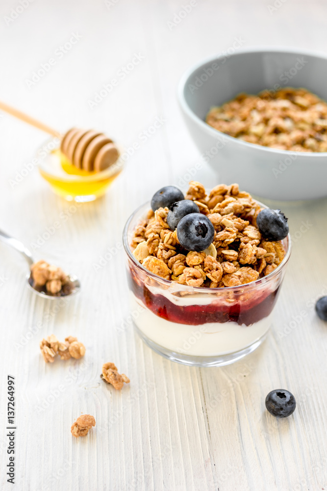 Healthy morning with granola breakfast on white kitchen table