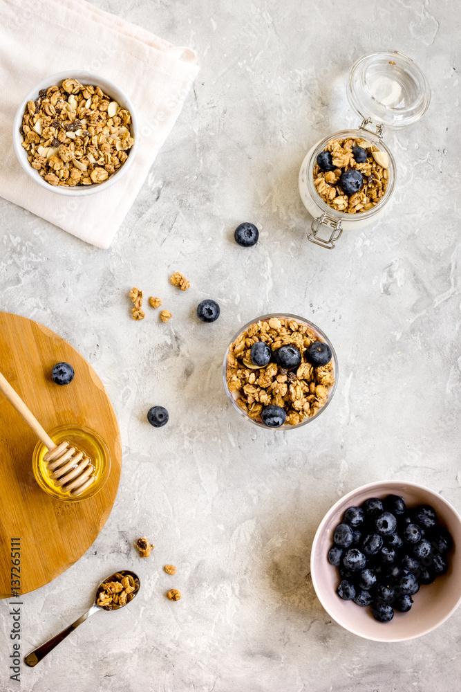 Oat flakes with honey and berries on table background top view