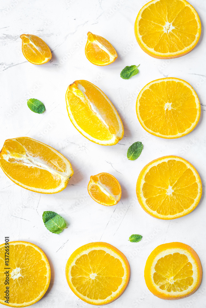 Slices for orange juice on white background top view pattern