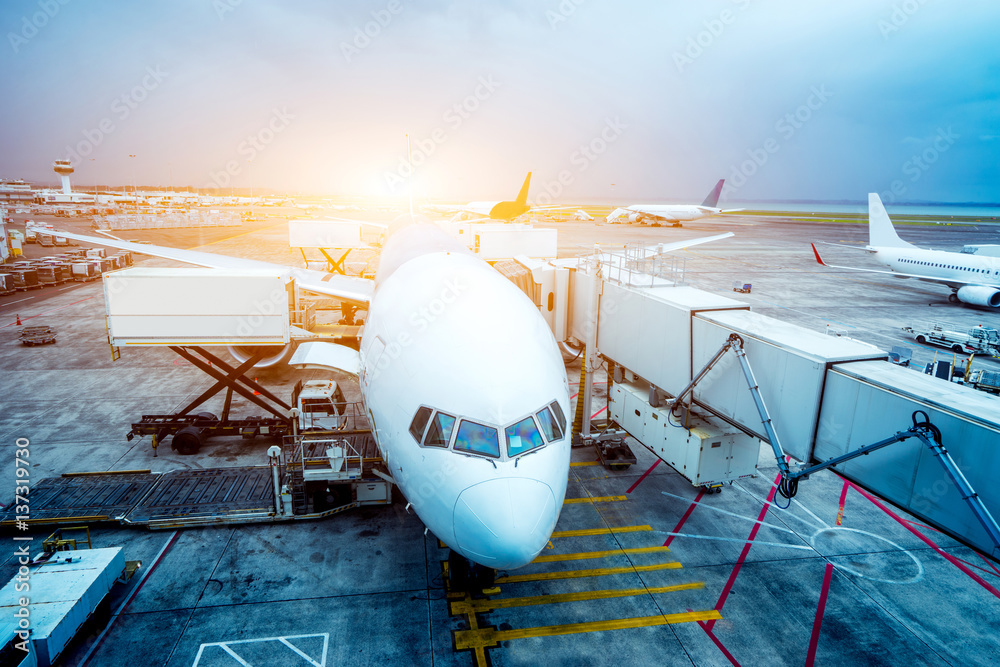 airport with crowded airplanes with sunbeam