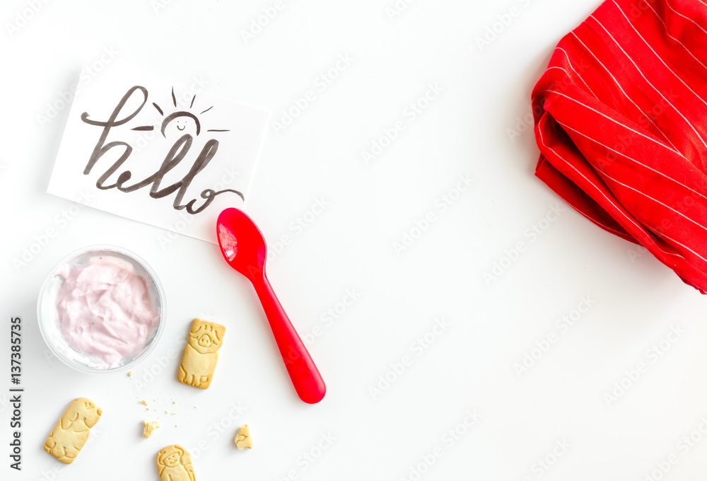 concept kid breakfast with yogurt top view white background