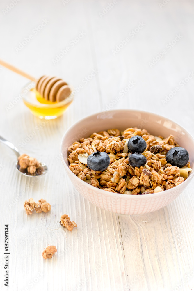 Healthy morning with granola breakfast on white kitchen table