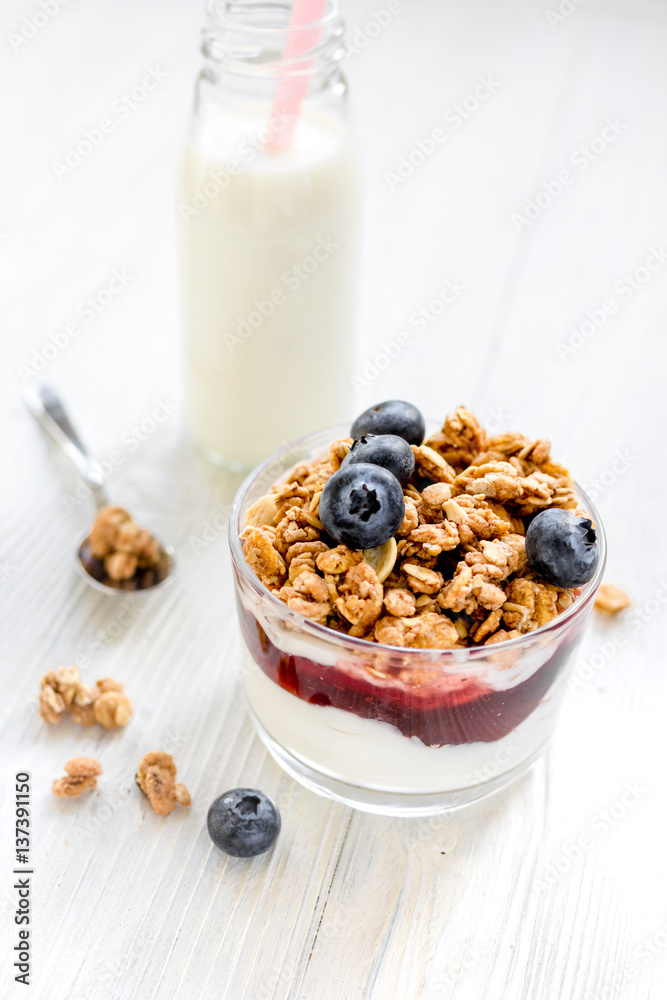 Healthy morning with granola breakfast on white kitchen table