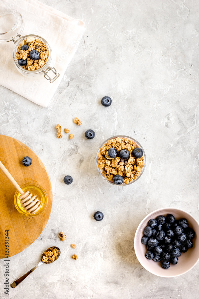 Oat flakes with honey and berries on table background top view