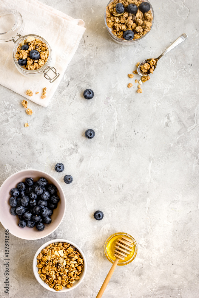 Oat flakes with honey and berries on table background top view