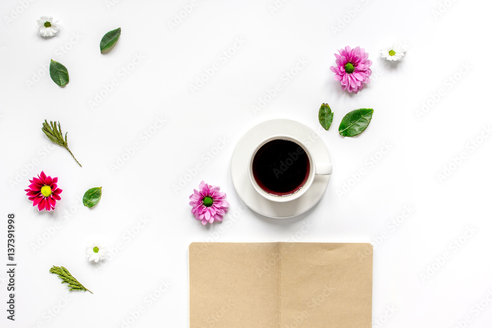 Froral flat lay with cup and notepaper top view mockup